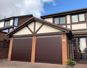 Two brown garage doors on house