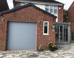 Grey garage door at the front of a house